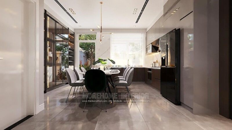 Mẫu thiết kế nội thất phòng bếp kiểu dáng chữ L hiện đại ôm trọn phòng ăn trong lòng.