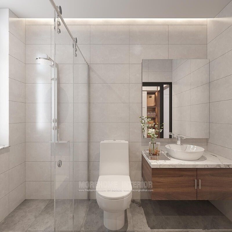 Bạn muốn sở hữu một thiết kế phòng tắm đơn giản nhưng đẹp mắt, sử dụng vách tắm kính cửa trượt giúp không gian trở nên thông thoáng, tiện ích, gương ốp tường không bo viền, tường đơn sắc nhưng tạo nên một bức tranh sang trọng và ấn tượng.
